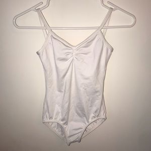 white pinched front open back leotard